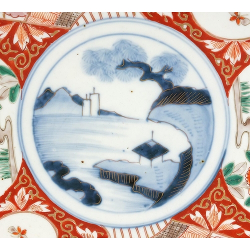 283 - Japanese Imari comprising a pair of chargers hand painted with flowers and landscapes and a bowl, th... 