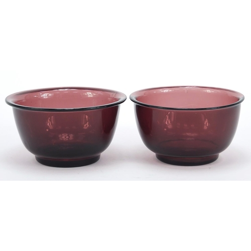 278 - Near pair of Chinese purple Peking glass bowls, the largest 11cm in diameter