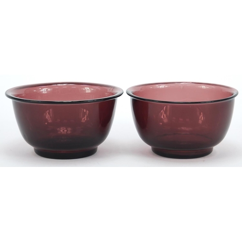 278 - Near pair of Chinese purple Peking glass bowls, the largest 11cm in diameter