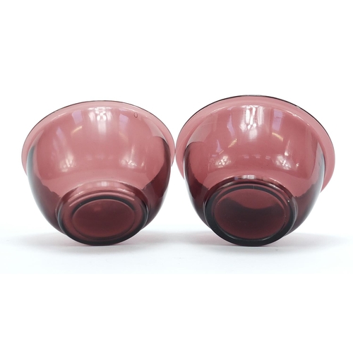 278 - Near pair of Chinese purple Peking glass bowls, the largest 11cm in diameter