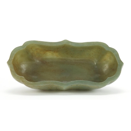 288 - Chinese green jade bowl carved with calligraphy, six figure character marks to the base, 16cm wide