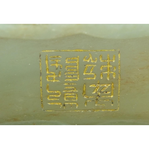 288 - Chinese green jade bowl carved with calligraphy, six figure character marks to the base, 16cm wide