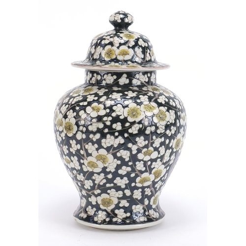 181 - Chinese porcelain baluster vase and cover hand painted with prunus flowers, 27.5cm high