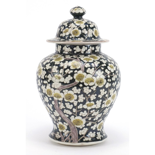 181 - Chinese porcelain baluster vase and cover hand painted with prunus flowers, 27.5cm high