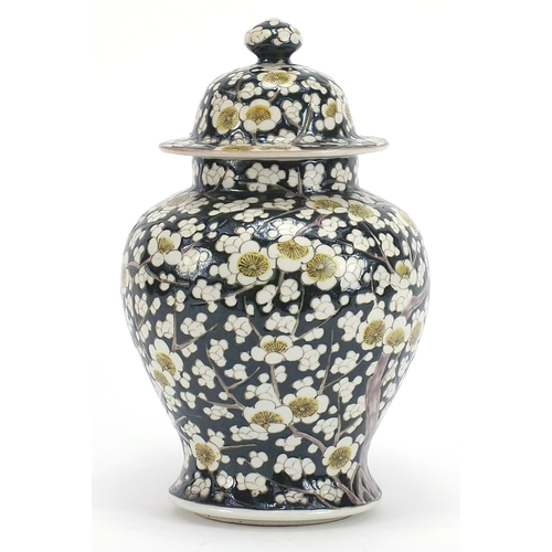 181 - Chinese porcelain baluster vase and cover hand painted with prunus flowers, 27.5cm high