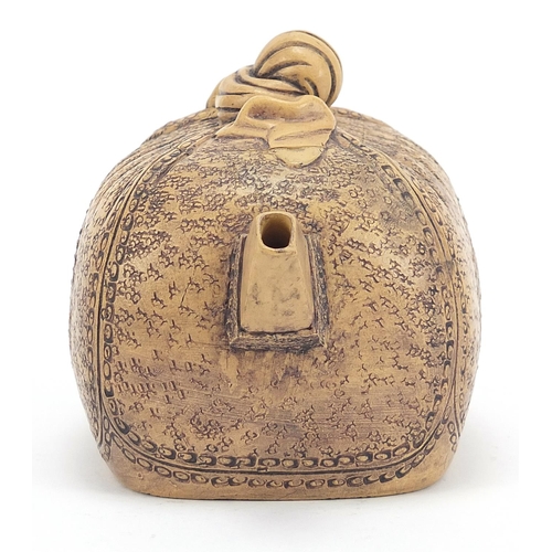 191 - Chinese Yixing terracotta sack design teapot, impressed character marks to the base, 17.5cm in lengt... 