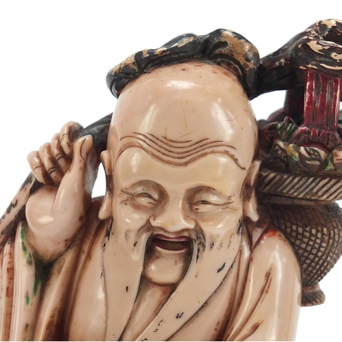 113 - Large Chinese pink soapstone carving of Shou Lao holding a basket and peach, 30cm high