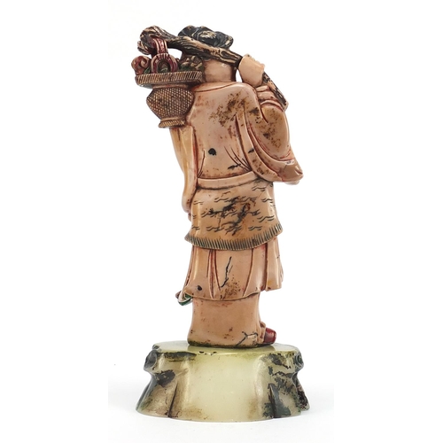 113 - Large Chinese pink soapstone carving of Shou Lao holding a basket and peach, 30cm high