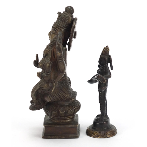 397 - Two Indian patinated bronze votive figures, the largest 16.5cm high