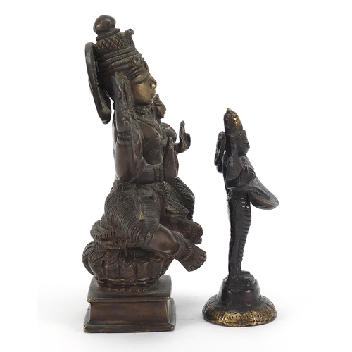 397 - Two Indian patinated bronze votive figures, the largest 16.5cm high