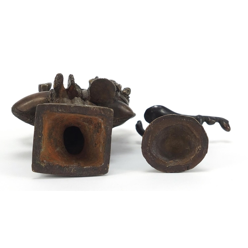 397 - Two Indian patinated bronze votive figures, the largest 16.5cm high