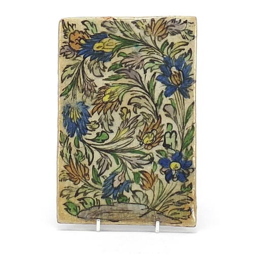 130 - Persian Iznik pottery tile hand painted with flowers, 19.5cm x 13cm