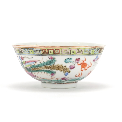 275 - Chinese porcelain bowl hand painted in the famille rose palette with a dragon and phoenix chasing a ... 