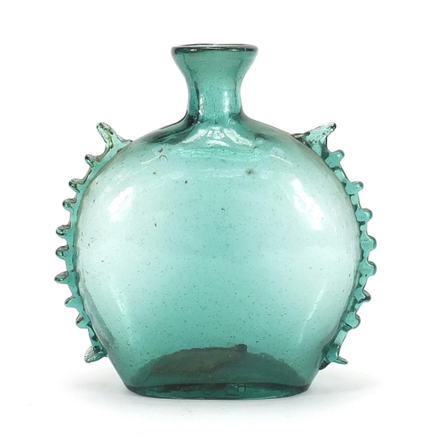 83 - Antique green glass bottle shaped vase with applied frilled edges, 20cm high