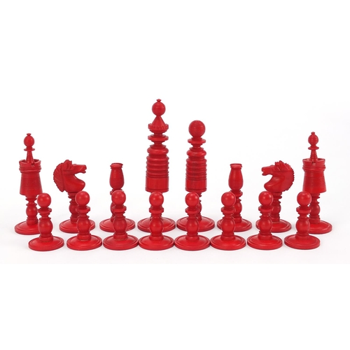 139 - Carved bone half stained chess set with mahogany case, the largest pieces each 9cm high