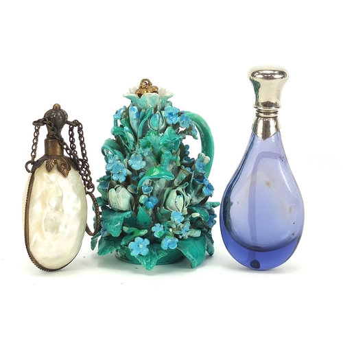 781 - Three scent bottles including a floral encrusted porcelain example, the largest 9.5cm high