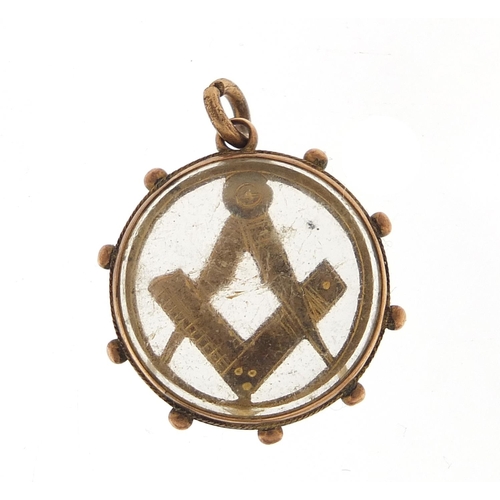 988 - Victorian 9ct gold masonic pendant with bevelled glass, 2cm in diameter, 4.8g