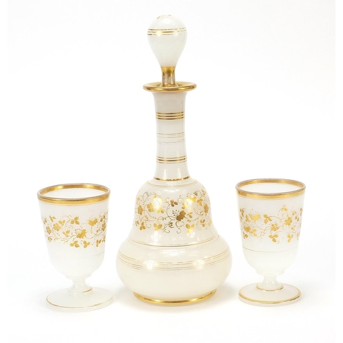 86 - Antique French opaline glass dressing table set gilded with flowers comprising bottle and two glasse... 