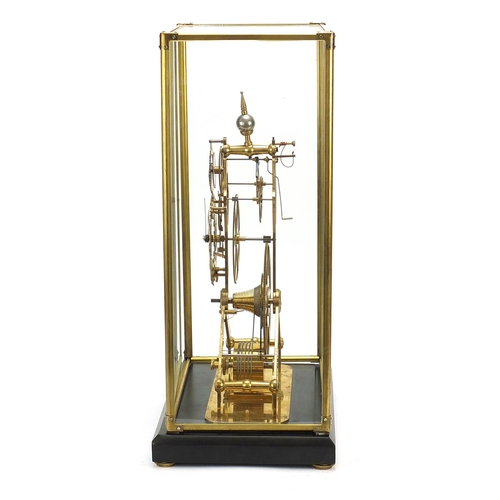 856 - Gothic style brass skeleton clock with moon face dial and glass display case, with key and pendulum,... 