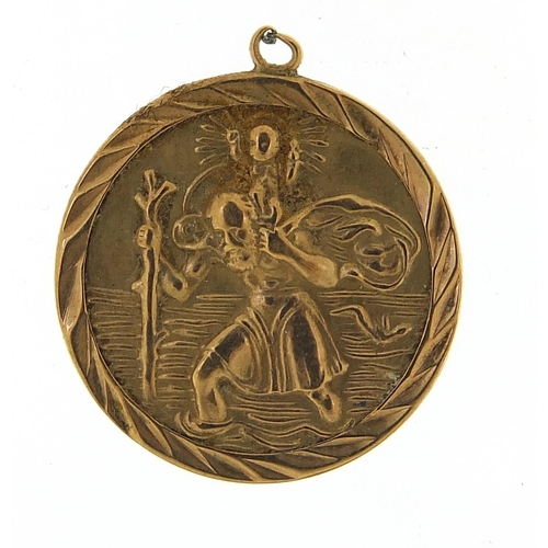 1110 - 9ct gold St Christopher pendant, 18mm in diameter, 1.7g