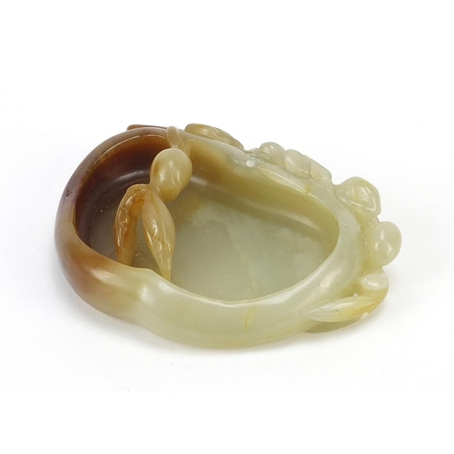 478 - Chinese naturalistic celadon and russet jade brush washer carved with a water dragon, 8.5cm wide