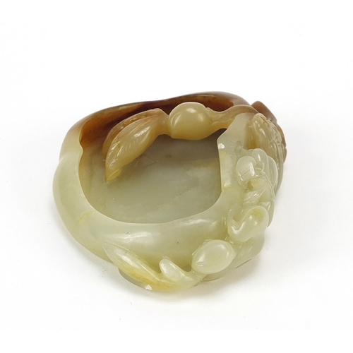 478 - Chinese naturalistic celadon and russet jade brush washer carved with a water dragon, 8.5cm wide