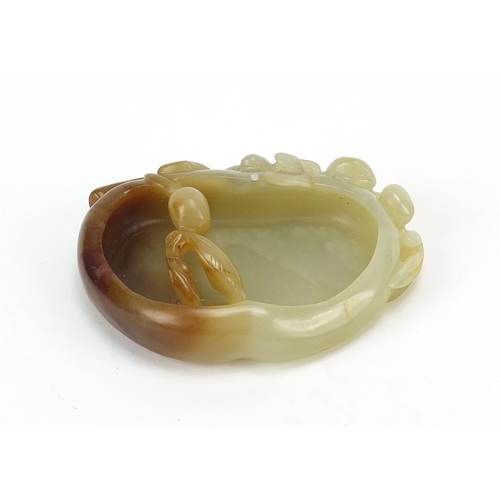 478 - Chinese naturalistic celadon and russet jade brush washer carved with a water dragon, 8.5cm wide