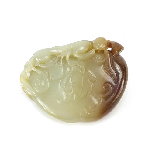 478 - Chinese naturalistic celadon and russet jade brush washer carved with a water dragon, 8.5cm wide