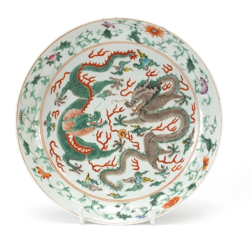 465 - Chinese porcelain shallow dish finely hand painted in the famille verte palette with two dragons cha... 