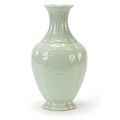 925 - Chinese porcelain quatrefoil vase having a celadon glaze, decorated in relief with bats and fruit, f... 