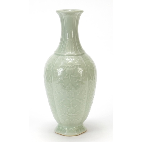 925 - Chinese porcelain quatrefoil vase having a celadon glaze, decorated in relief with bats and fruit, f... 