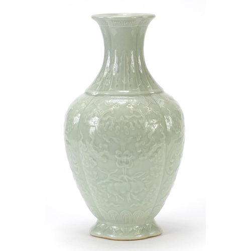 925 - Chinese porcelain quatrefoil vase having a celadon glaze, decorated in relief with bats and fruit, f... 