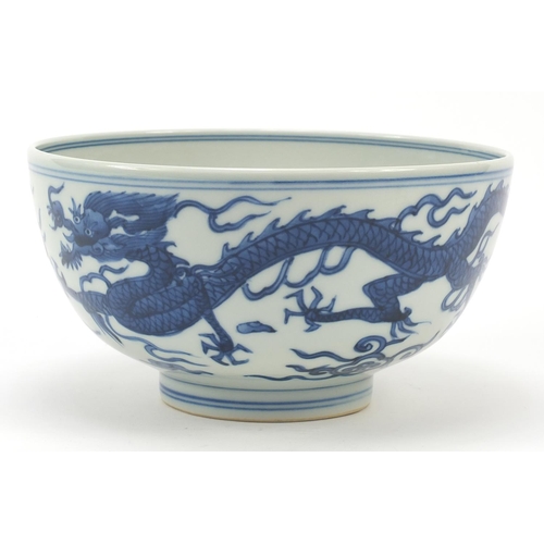 994 - Chinese blue and white porcelain bowl hand painted with a dragon and phoenix amongst clouds chasing ... 