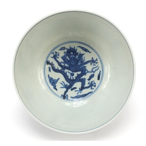 994 - Chinese blue and white porcelain bowl hand painted with a dragon and phoenix amongst clouds chasing ... 