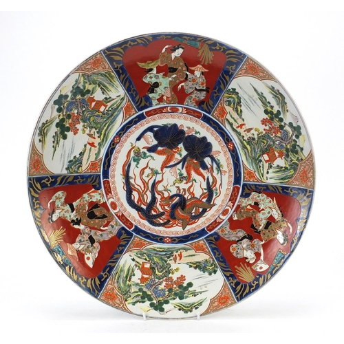 1002 - Japanese Imari porcelain charger hand painted with panels of figures and landscapes, impressed and p... 