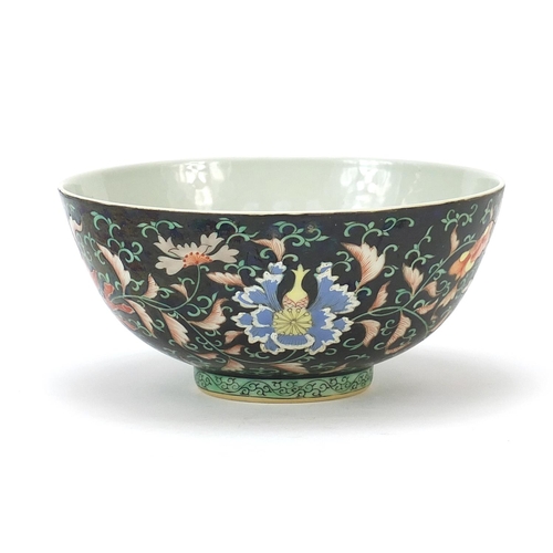 926 - Chinese porcelain bowl hand painted in the famille noir palette with flower heads amongst scrolling ... 