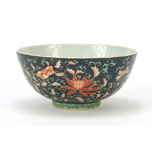 926 - Chinese porcelain bowl hand painted in the famille noir palette with flower heads amongst scrolling ... 