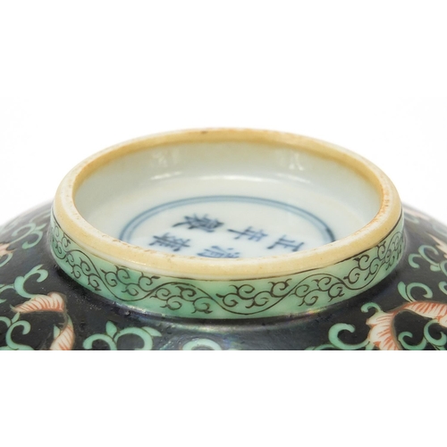 926 - Chinese porcelain bowl hand painted in the famille noir palette with flower heads amongst scrolling ... 