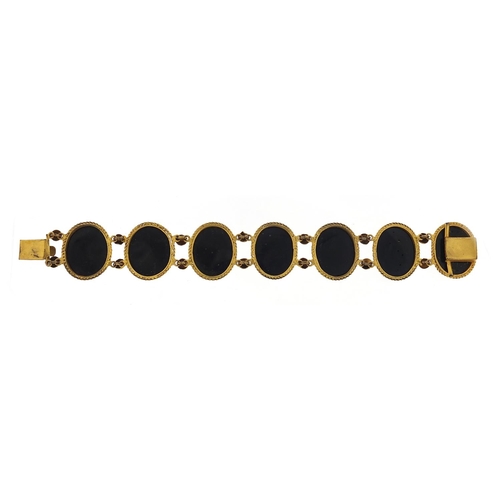 695 - Antique Italian gilt metal and black onyx, bracelet painted with ruins, 18cm in length, 36.8g