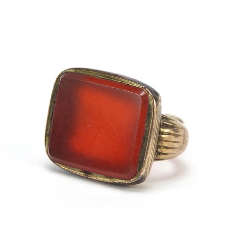 1112 - Antique gold coloured metal carnelian fob, 2.1cm high, 4.4g