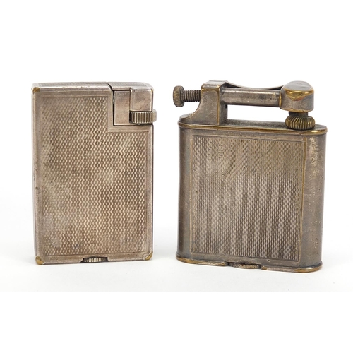 750 - Two Dunhill silver plated pocket lighters with engine turned decoration, the largest 5cm high