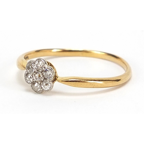 811 - 18ct gold diamond flower head ring, size R/S, 1.8g