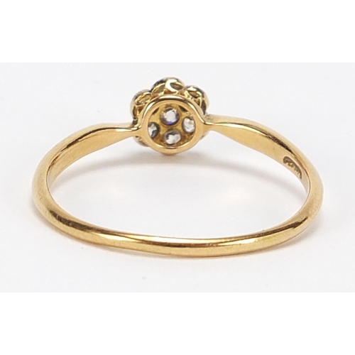 811 - 18ct gold diamond flower head ring, size R/S, 1.8g