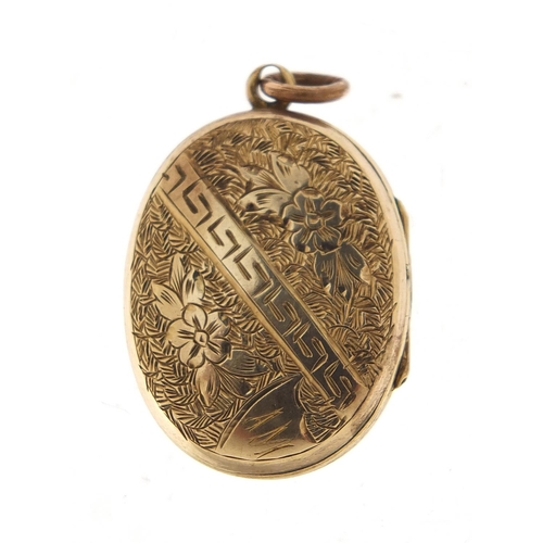 1074 - Gold coloured metal and enamel locket set with seed pearls and coral, 2.5cm high, 6.4g