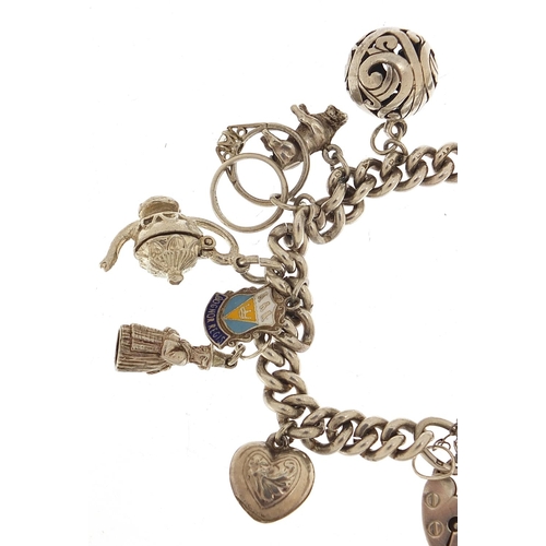 455 - Silver charm bracelet with a selection of mostly silver charms including a top hat, lion, dragon and... 