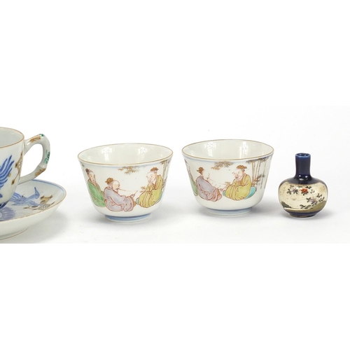 1003 - Japanese ceramics including a cup with saucer hand painted with phoenixes, miniature Satsuma vase an... 