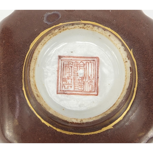 709 - Chinese quatrefoil brown ground porcelain footed bowl hand painted with panels of landscapes and gil... 