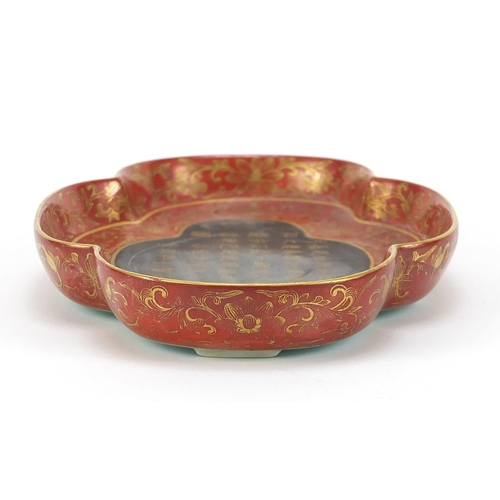 561 - Chinese porcelain four footed iron red and turquoise ground quatrefoil dish, gilded with calligraphy... 