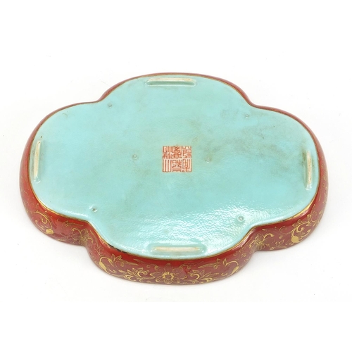 561 - Chinese porcelain four footed iron red and turquoise ground quatrefoil dish, gilded with calligraphy... 