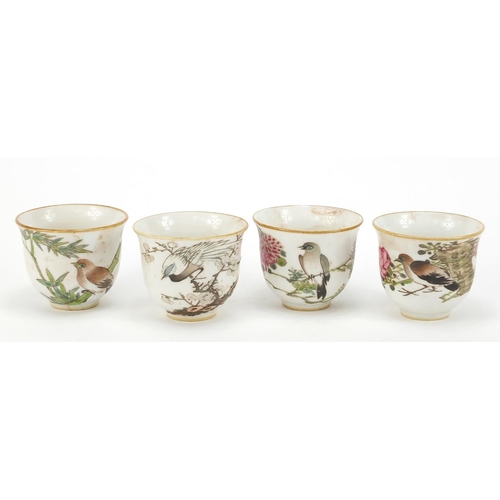 107 - Set of four Chinese porcelain teacups, each hand painted in the famille rose palette with a bird, fl... 